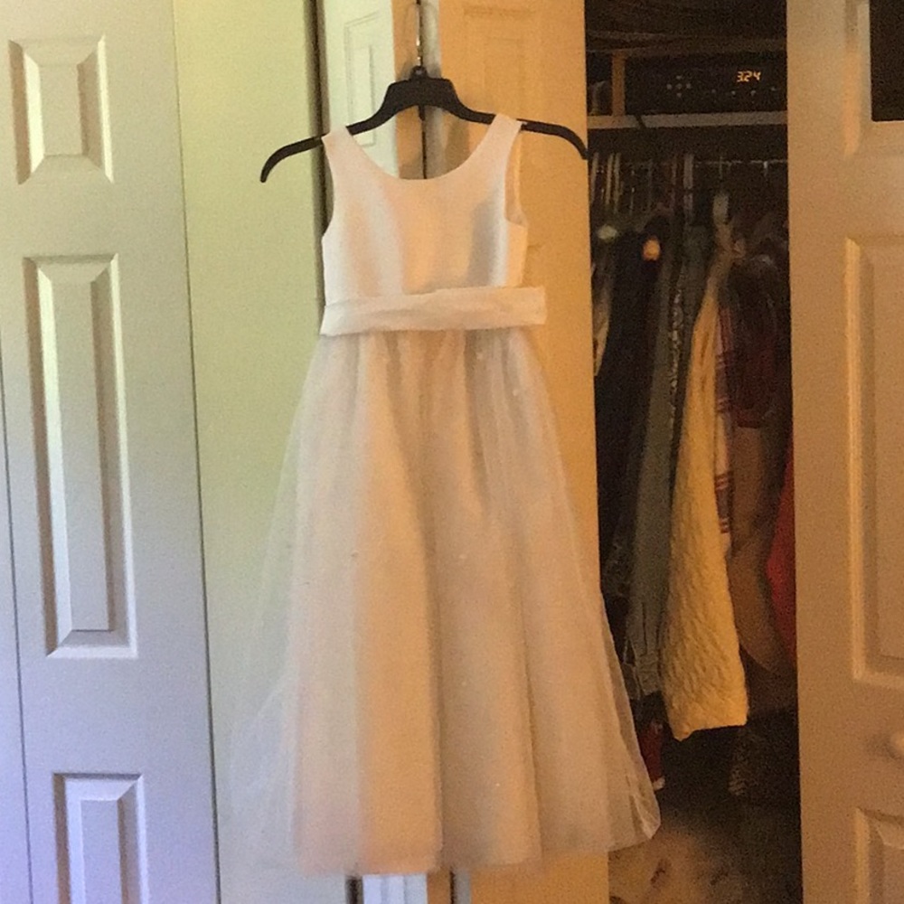 David’s bridal flower girl dress. White with beds on the skirt. Great condition.